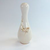 Blanc de Chine footed vase late 18th/19th century decorated with a Dragon relief. H:22cm