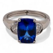 18ct white gold Tanzanite & half moon / semi navette diamond set shoulders. Adjustable size ring.