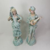 Two large Continental figures depicting a male musician and a female dancer, height 49cm (2).
