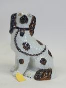 Staffordshire mantel sitting Spaniel with metallic copper brown effect. H:-24cm