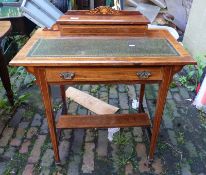 An inlaid walnut ladies' desk raised on tapering square legs and brass castors 77cm W x 82cm H x