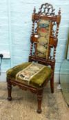 Gothic revival prie-dieu chair. Heavily carved oak frame with upholstered seat cushion and back