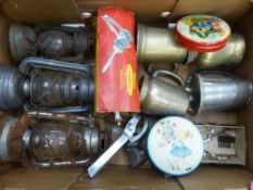 Mixed metalware to include three Tilley lamps, brass and white metal tankards, vintage tins, etc (