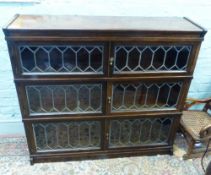 Simpoles chapter stacking oak bookcase. Double doors with leaded glass fronts, 3 stacks total.