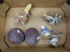 Two matt-finish bird figures by Kowa on wooden plinths, together with a similar example (3).