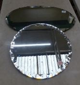 Two vintage frameless wall mirrors with bevelled edges, size of largest 65cm x 38cm (2).