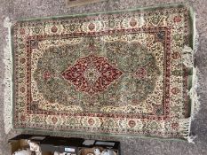 Tasselled Rug labelled Kashmir Silkron Fibre, delicate design mixed cream, light green and red
