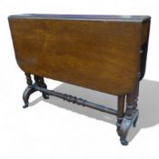 Mahogany drop leaf gate leg table raised on brass castors, W 92cm, D 92cm, H 72cm.