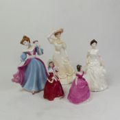 A group of five ceramic lady figurines, Royal Doulton Amy HN4782, Christmas Morn HN3212, and a