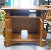 Walnut Two door music cabinet, H70cm x W81cm x D39cm.