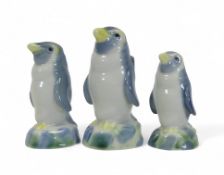 Wade, three graduating Penguin family decanters. (3)