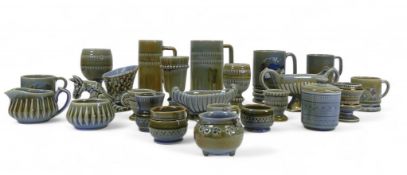 A collection of Irish Wade to include tankards, trinket boxes, pin dishes, animal novelty vases