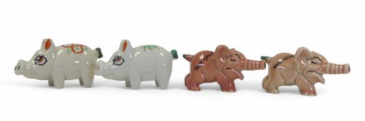 Wade, Shamrock Pottery figures to include:- Irish Shamrock Pigs two floral, & two pink, from the