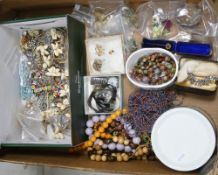 A large collection of vintage costume jewellery including beads, wristwatches, many brooches,