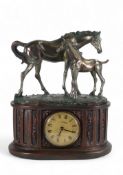 A Mantel Clock from the Juliana Collection of a bronzed style mare and foal. measures:- 30cm tall
