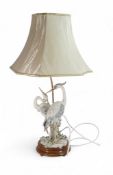 Capodimonte Giuseppe Armani Lamp base displayed on a wooden plinth depicting a pair of Herons,