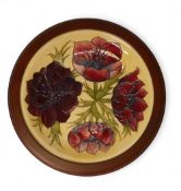 Moorcroft Plate 783/10, 'Anemone' design on Cream ground measures 30cm including surround