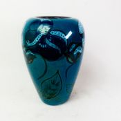 Poole Pottery vase with floral decoration on a teal ground, height 25cm.