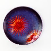 A Poole Pottery charger, vibrant abstract design, no backstamp, diameter 40cm.