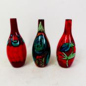 Poole Pottery vases x 3 in bottle form, height 16cm (3).