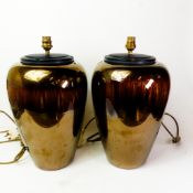 A pair of large Poole Pottery vases, both converted to table lamps with speakers to the interior