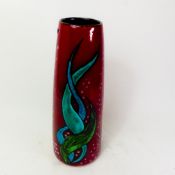 Poole Pottery vase with aquatic decoration on a deep red ground, height 33cm.