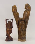 Vintage hand-carved wooden sculpture of two parrots perched on a stump, together with carved