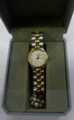 Longines Conquest Ladies Gold Tone and Steel Quartz Wristwatch. Features: Day Display Aperture,