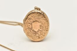 A 9CT GOLD LOCKET, an oval form locket, floral and scrolling acanthus etched detail to the front