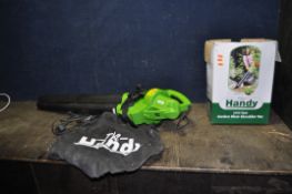 A 'THE HANDY' GARDEN VACUUM with collection bag (PAT pass and working)