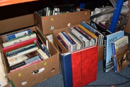 FOUR BOXES OF BOOKS AND STAMPS, to include approximately eighty to one hundred books in hardback and