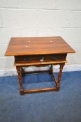A THEODORE ALEXANDER HARDWOOD SIDE TABLE, fitted with a single frieze drawer, raised on block and