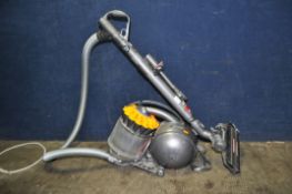 A DYSON DC28C VACUUM CLEANER with two attachments and an unbranded steam mop (both PAT pass and