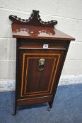 AN EDWARDIAN MAHOGANY PURDONIUM, with a raised back, the fall front door enclosing a metal insert,