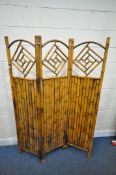 A THREE PANEL BAMBOO FOLDING SCREEN, each with geometric designs to the top, overall width 131cm x