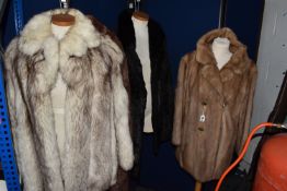A GROUP OF FOUR LADIES' VINTAGE FUR COATS, comprising an Arctic fox fur, a caramel coloured mink fur