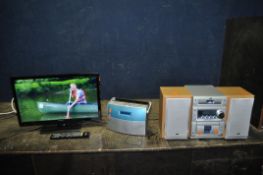 A HITACHI V18F08392 18in TV/DVD WITH REMOTE, an Alba DAB radio and a JVC mini Hi Fi and two speakers