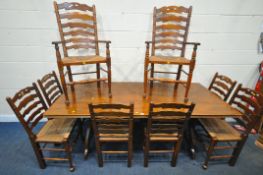 POSSIBLY THEODORE ALEXANDER, A RECTANGULAR HARDWOOD REFECTORY TABLE, raised on ornate trestle