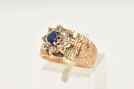 A 9CT GOLD SAPPHIRE AND SPINEL CLUSTER RING, flower shape cluster set with a central circular cut