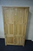 AN OAK FURNITURE LAND ROMSEY NATURAL SOLID OAK LARGE LARDER, with two sets of double doors, the