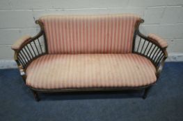 AN EDWARDIAN MAHOGANY AND INLAID SOFA, with striped upholstery, curved armrests, raised on square