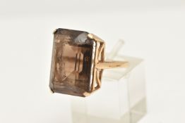 A 9CT GOLD SMOKY QUARTZ DRESS RING, large rectangular cut smoky quartz, measuring approximately 20.