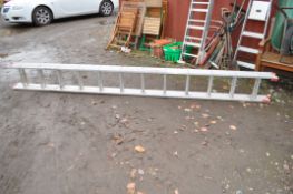 AN ALUMINIUM DOUBLE EXTENSION LADDERS BY CLIMA with twelve rungs to each 350cm length