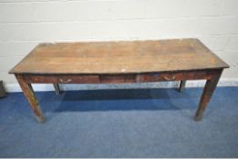AN EARLY 20TH CENTURY OAK TABLE, with a sloped top, two frieze drawers, raised on square tapered