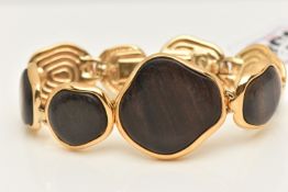 A 'YVES SAINT LAURENT' BRACELET, designed as abstract wooden panels with gold plated surround and