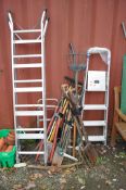 A COLLECTION OF GARDEN TOOLS AND ALUMINIUM STEPS including forks, rakes, spades, lawn clippers etc