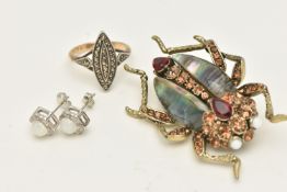 THREE ITEMS OF JEWELLERY, to include a yellow and white metal marcasite set ring, stamped 9ct