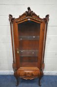 A REPRODUCTION ITALIAN STYLE DISPLAY CABINET, with scrolled crests and mounts, the single arched