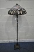A PAIR OF TIFFANY STYLE STANDARD LAMPS, the shade with coloured scrolled details, the pillar support