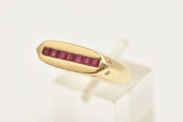 A YELLOW METAL GEM SET SIGNET RING, a rectangular form signet ring, channel set to the top with